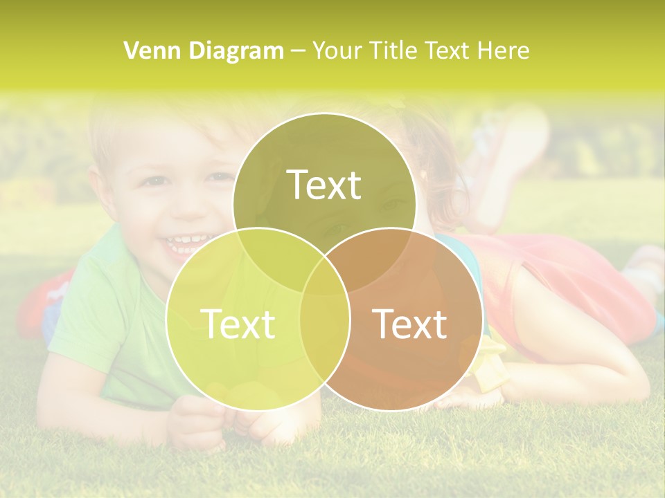 Two Young Children Laying On The Grass In A Park PowerPoint Template