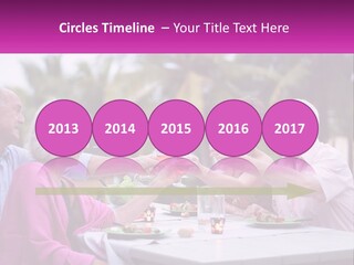 A Group Of People Toasting Wine Glasses At A Table PowerPoint Template