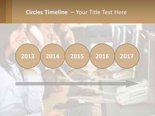 A Group Of People Sitting At A Desk Talking On Telephones PowerPoint Template