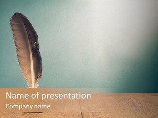 A Brown Feather Resting On A Wooden Table PowerPoint Template