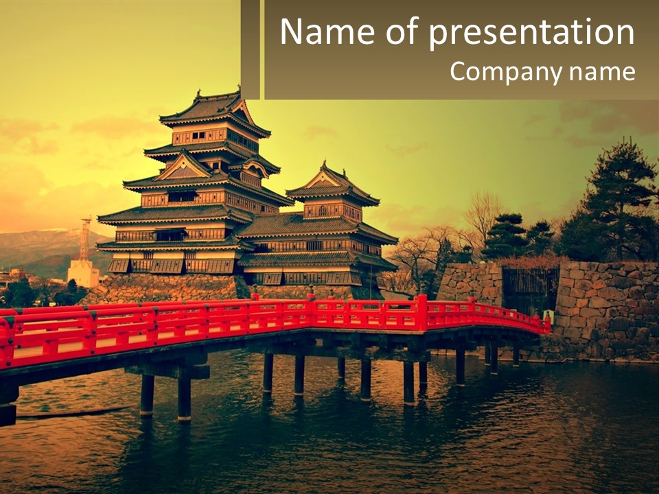 A Bridge Over A Body Of Water With A Building In The Background PowerPoint Template