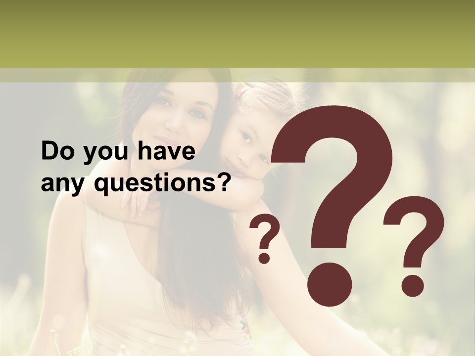 A Woman And A Child Are Sitting In The Grass PowerPoint Template