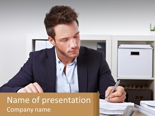 A Man Sitting At A Desk Writing On A Piece Of Paper PowerPoint Template