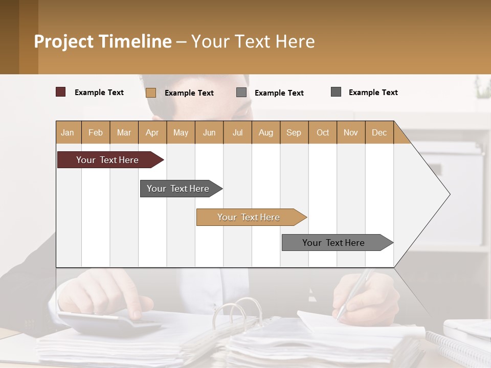 A Man Sitting At A Desk Writing On A Piece Of Paper PowerPoint Template
