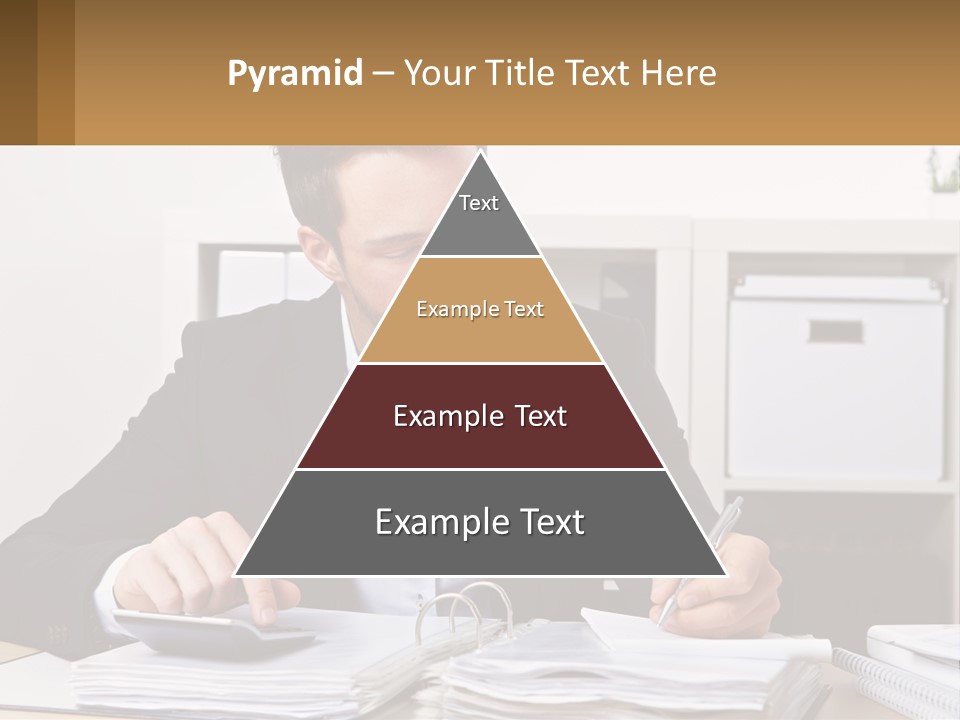 A Man Sitting At A Desk Writing On A Piece Of Paper PowerPoint Template