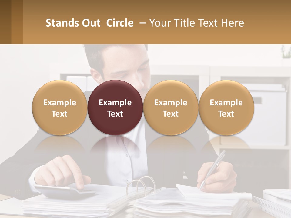 A Man Sitting At A Desk Writing On A Piece Of Paper PowerPoint Template