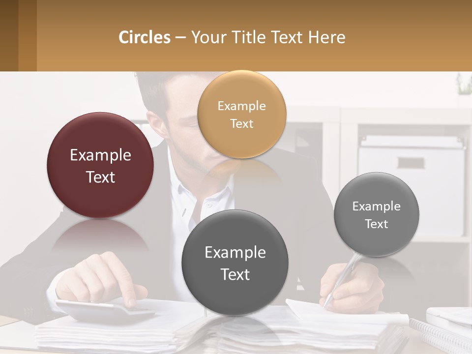 A Man Sitting At A Desk Writing On A Piece Of Paper PowerPoint Template