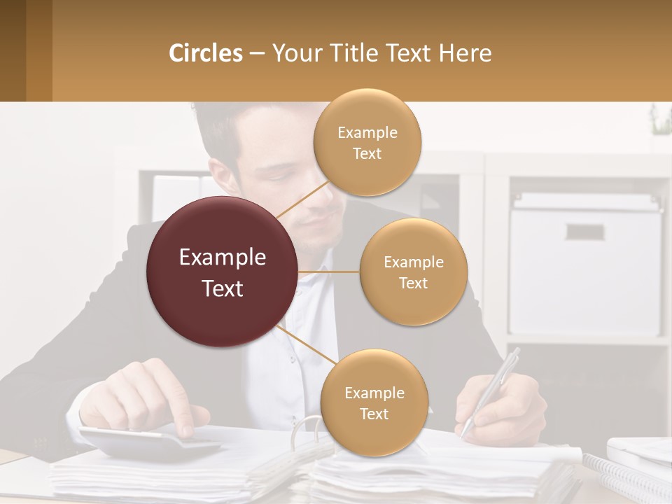 A Man Sitting At A Desk Writing On A Piece Of Paper PowerPoint Template