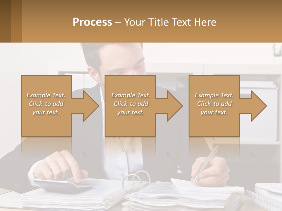 A Man Sitting At A Desk Writing On A Piece Of Paper PowerPoint Template