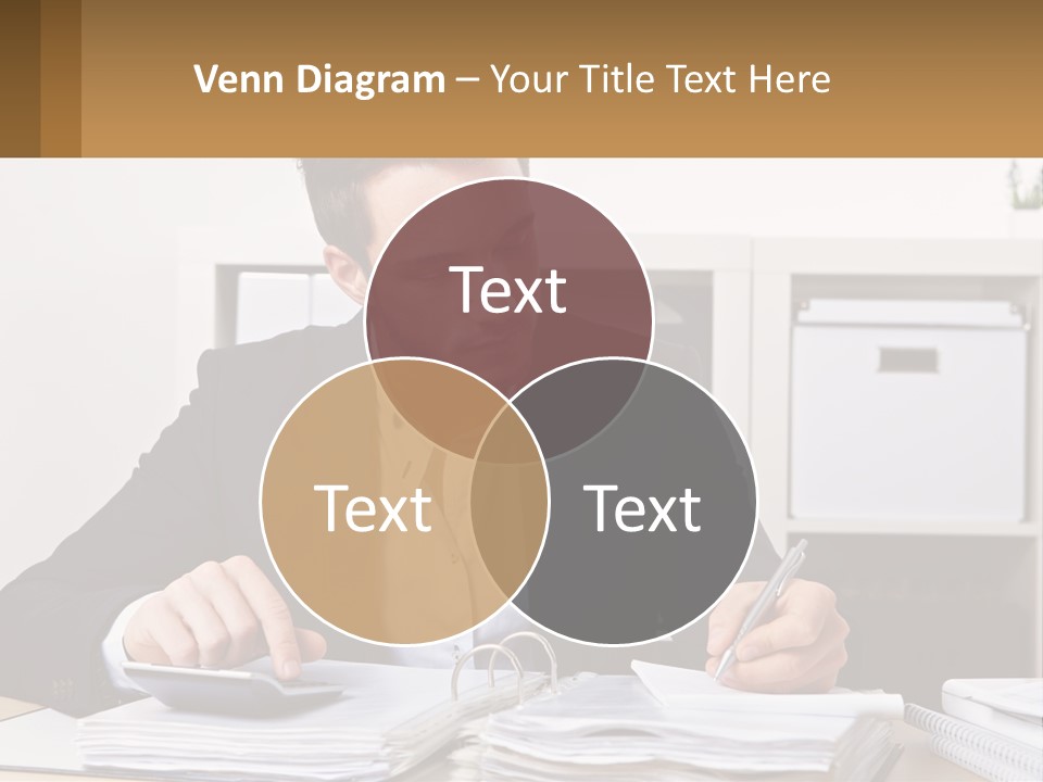 A Man Sitting At A Desk Writing On A Piece Of Paper PowerPoint Template