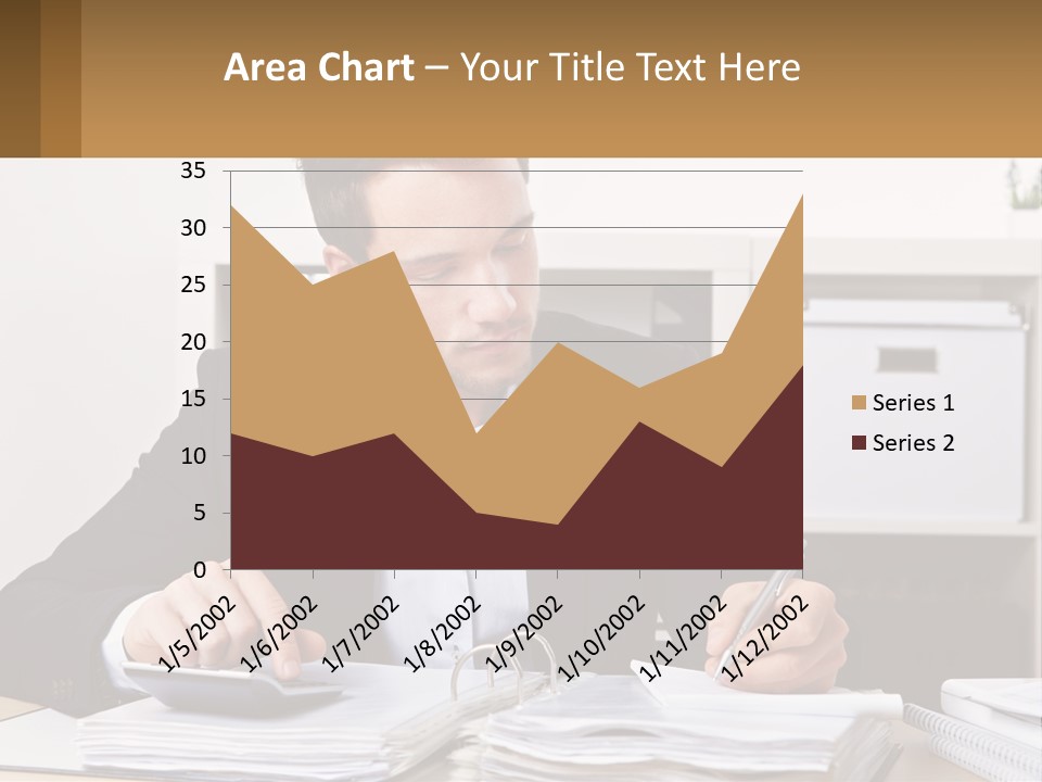 A Man Sitting At A Desk Writing On A Piece Of Paper PowerPoint Template
