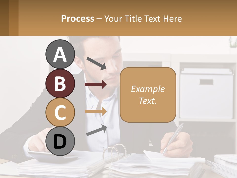 A Man Sitting At A Desk Writing On A Piece Of Paper PowerPoint Template