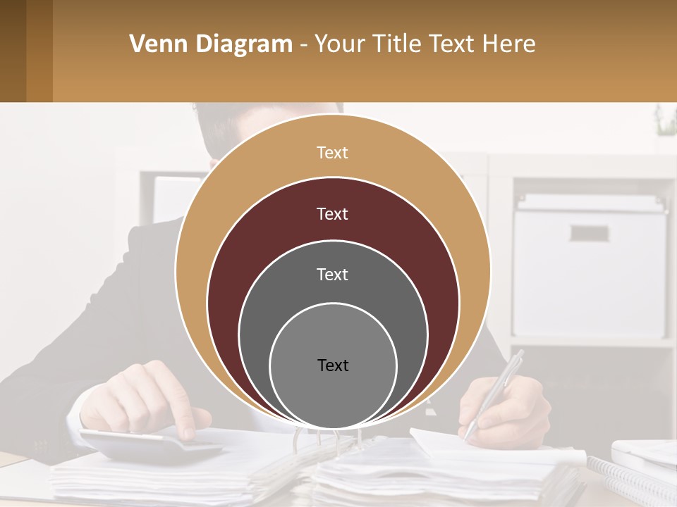 A Man Sitting At A Desk Writing On A Piece Of Paper PowerPoint Template