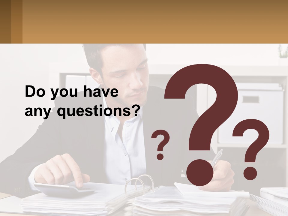 A Man Sitting At A Desk Writing On A Piece Of Paper PowerPoint Template