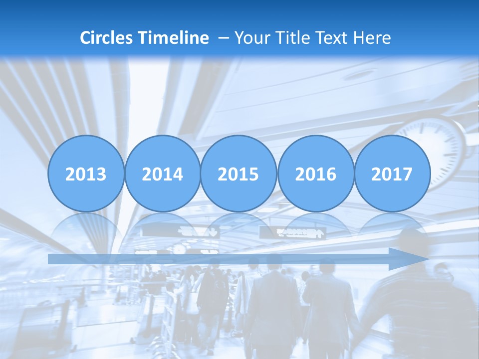 A Group Of People Walking Through A Train Station PowerPoint Template