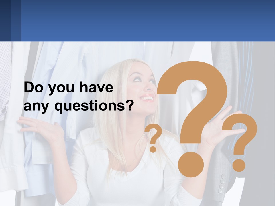 A Woman Standing In Front Of A Rack Of Shirts PowerPoint Template