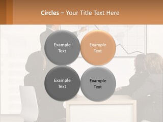 A Group Of People Sitting Around A Table In Front Of A Whiteboard PowerPoint Template