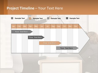 A Group Of People Sitting Around A Table In Front Of A Whiteboard PowerPoint Template