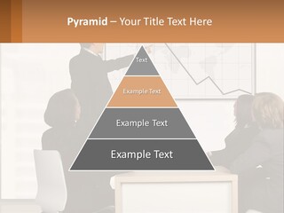 A Group Of People Sitting Around A Table In Front Of A Whiteboard PowerPoint Template