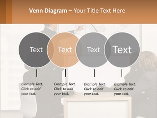 A Group Of People Sitting Around A Table In Front Of A Whiteboard PowerPoint Template