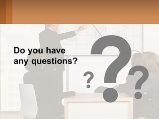 A Group Of People Sitting Around A Table In Front Of A Whiteboard PowerPoint Template