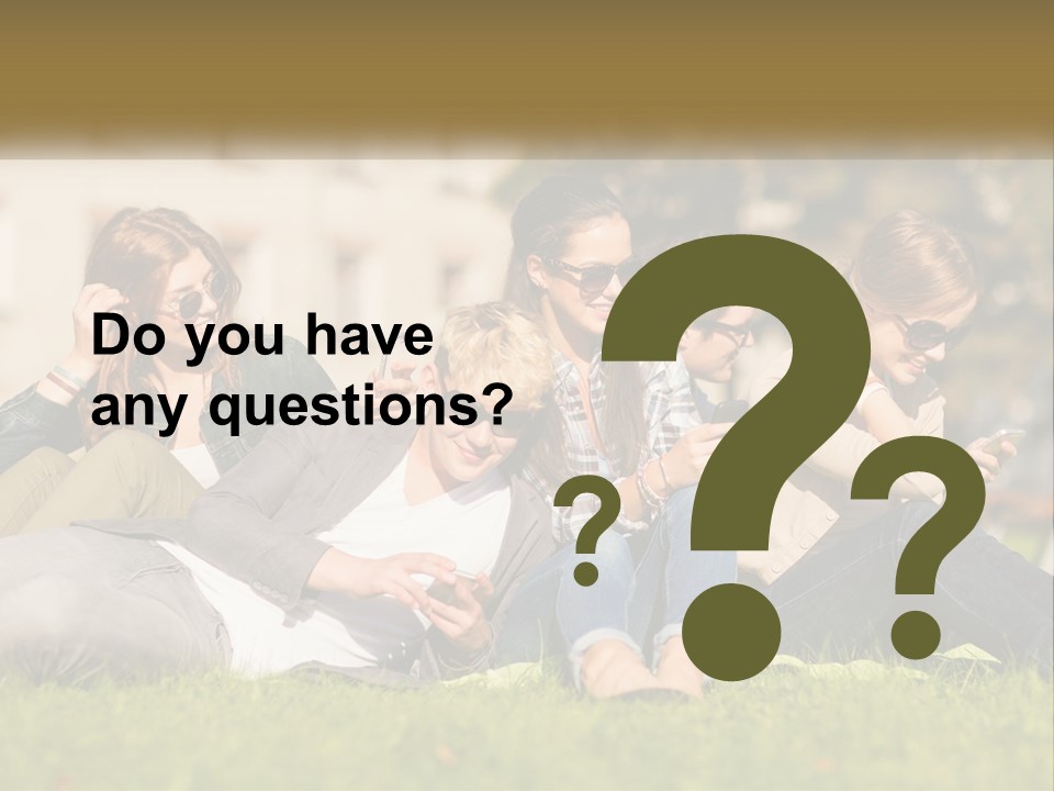 A Group Of People Sitting On The Grass Looking At Their Cell Phones PowerPoint Template