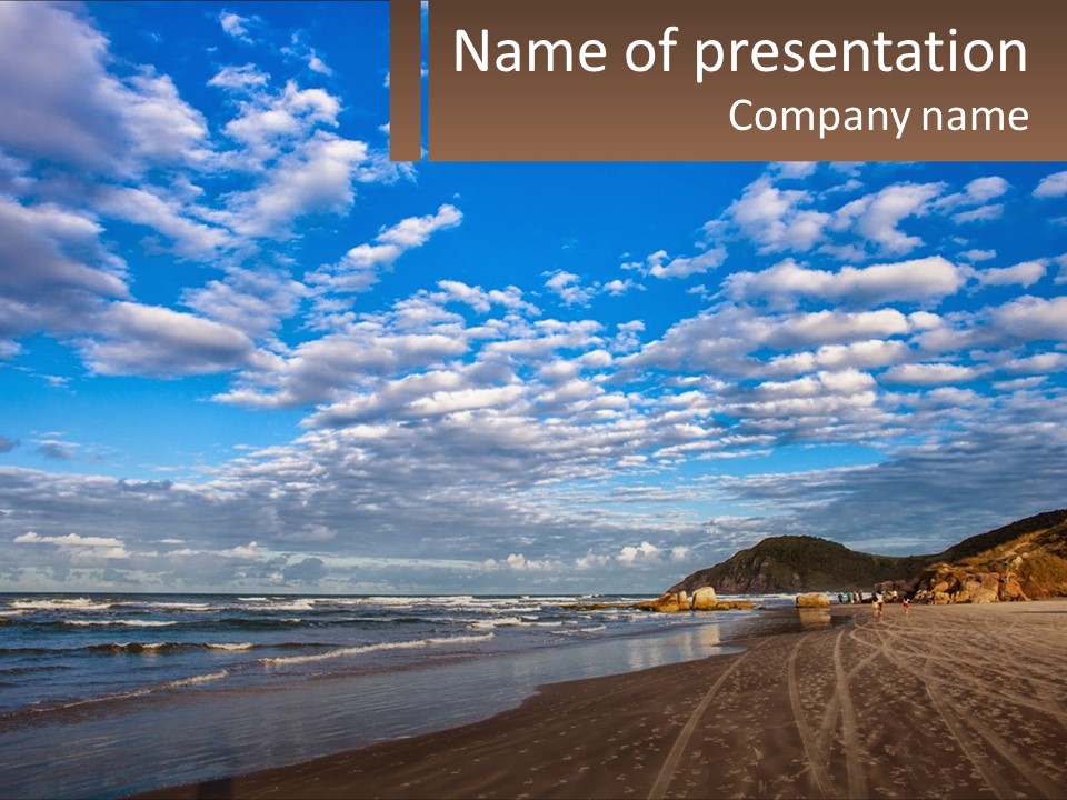 A Picture Of A Beach With Clouds In The Sky PowerPoint Template