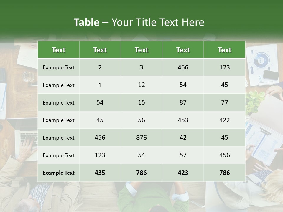 A Group Of People Sitting At A Table Working On Laptops PowerPoint Template
