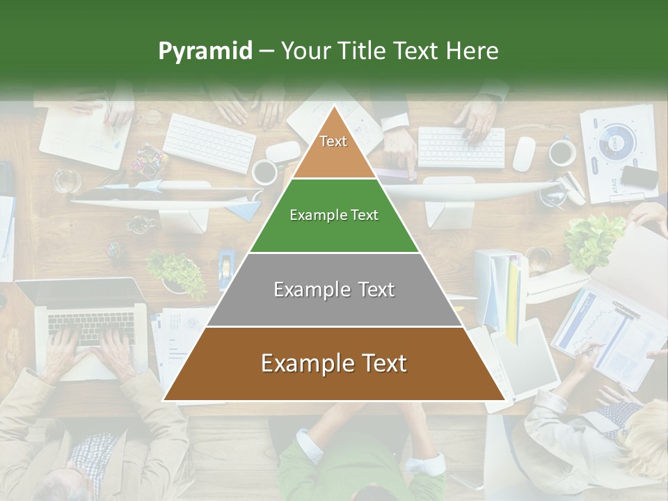 A Group Of People Sitting At A Table Working On Laptops PowerPoint Template