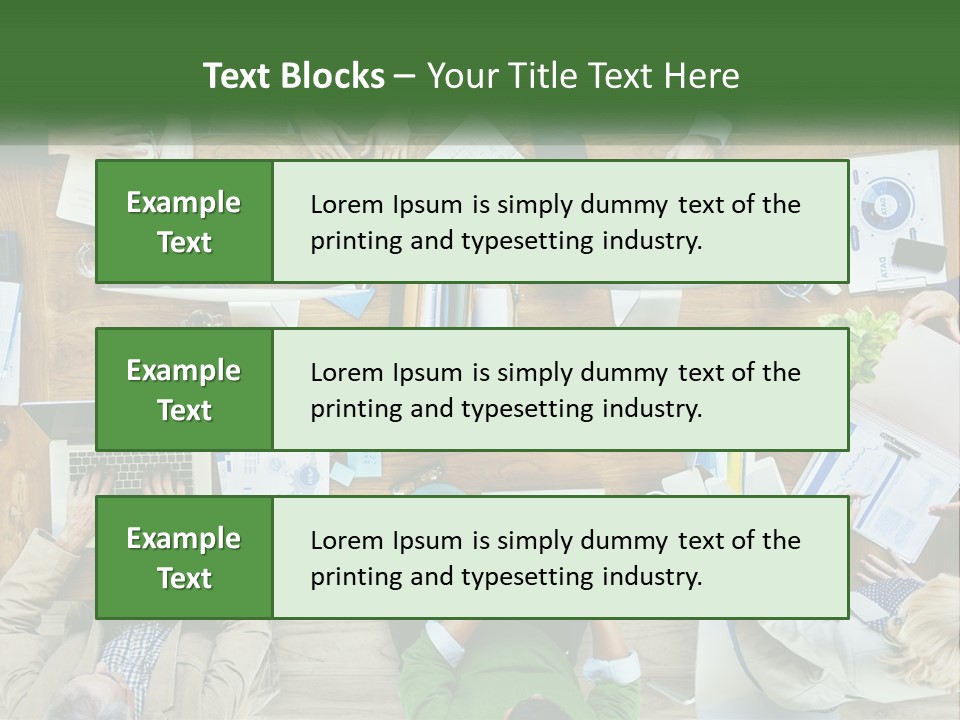 A Group Of People Sitting At A Table Working On Laptops PowerPoint Template