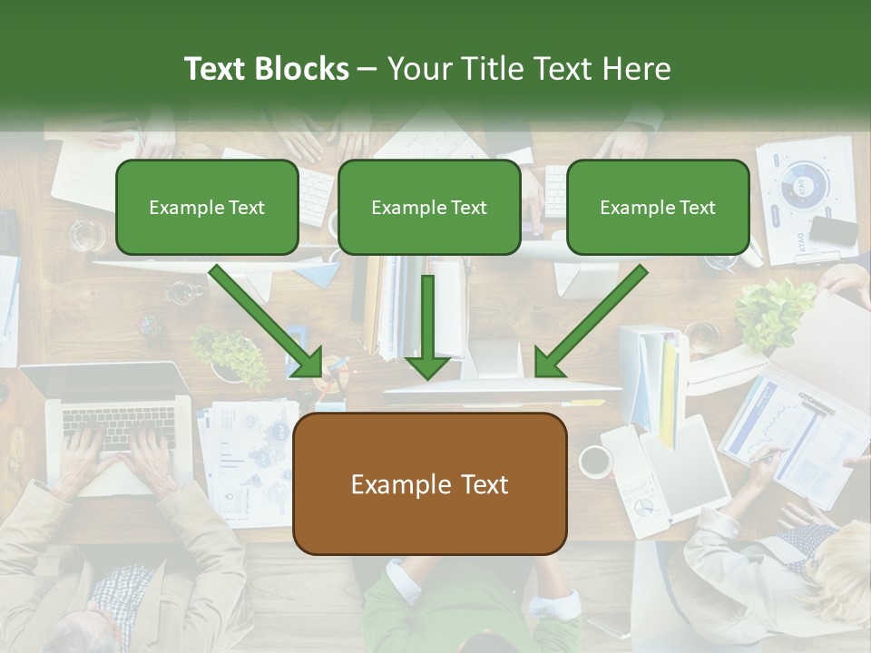 A Group Of People Sitting At A Table Working On Laptops PowerPoint Template