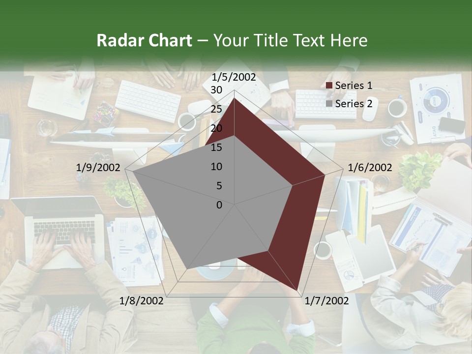 A Group Of People Sitting At A Table Working On Laptops PowerPoint Template