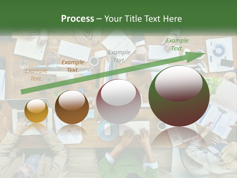 A Group Of People Sitting At A Table Working On Laptops PowerPoint Template