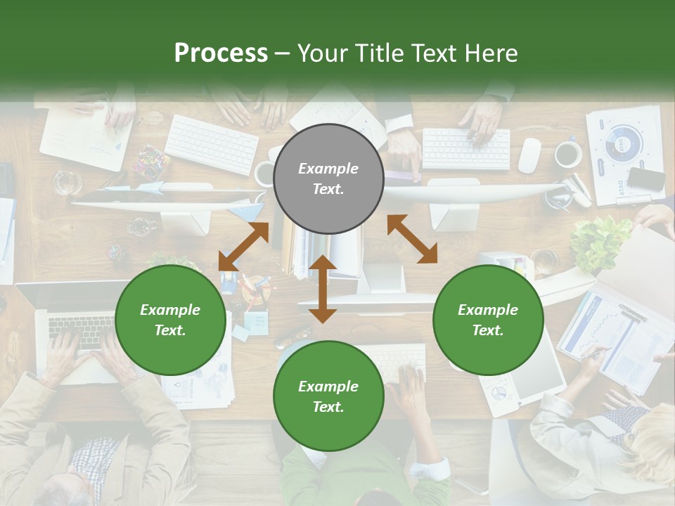 A Group Of People Sitting At A Table Working On Laptops PowerPoint Template