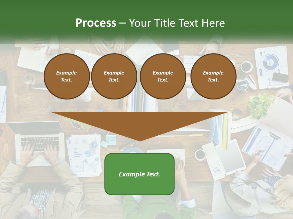 A Group Of People Sitting At A Table Working On Laptops PowerPoint Template