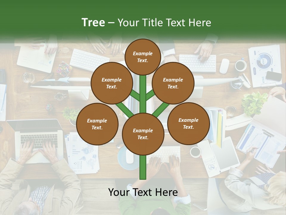 A Group Of People Sitting At A Table Working On Laptops PowerPoint Template