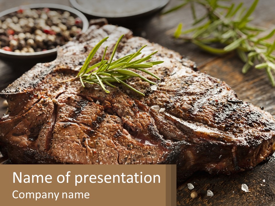 A Piece Of Steak With A Sprig Of Rosemary On Top Of It PowerPoint Template