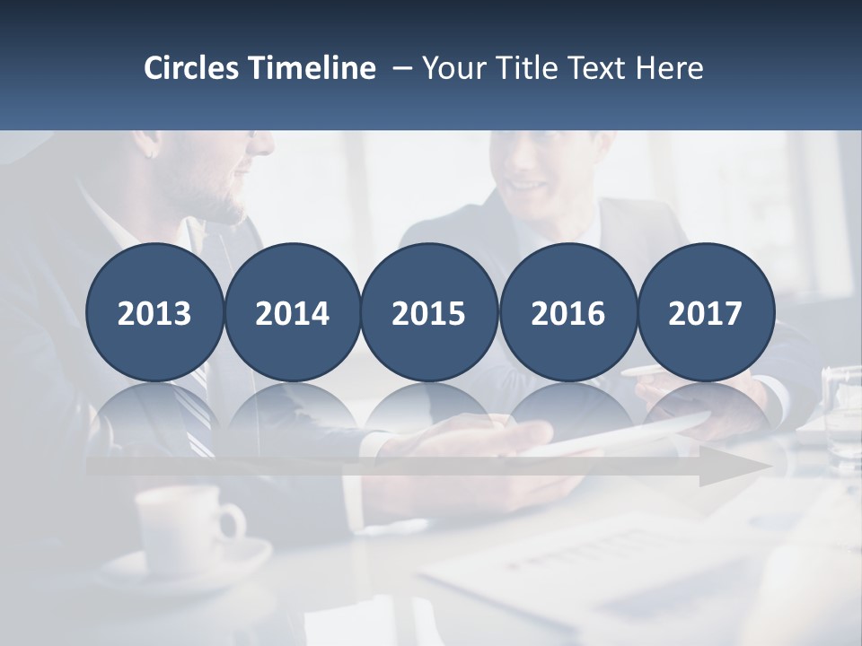 Two Men Sitting At A Table With A Tablet PowerPoint Template