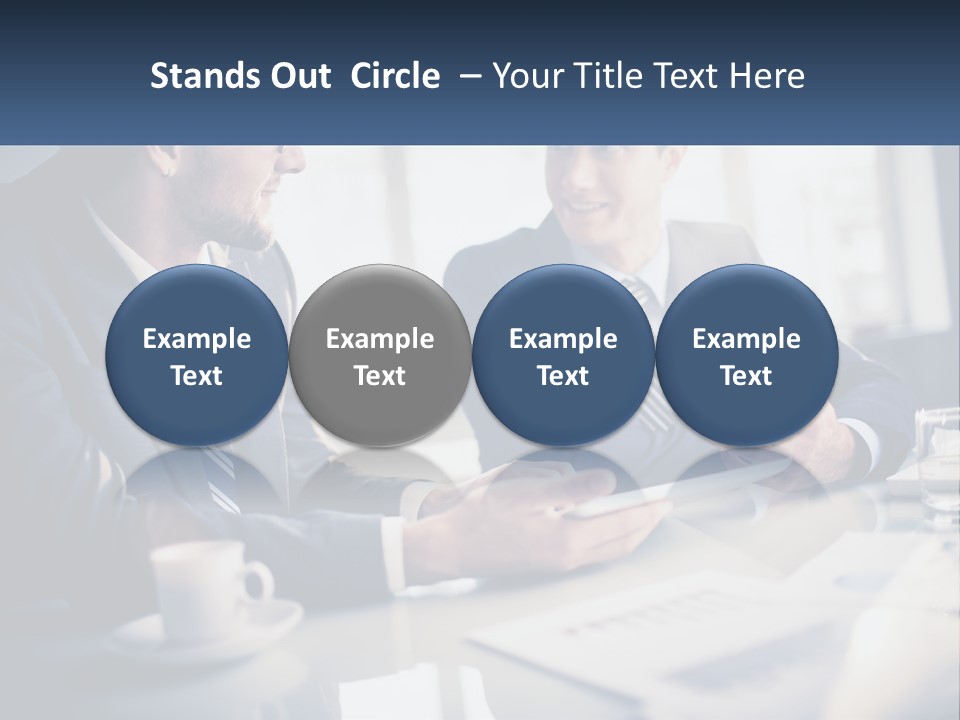 Two Men Sitting At A Table With A Tablet PowerPoint Template