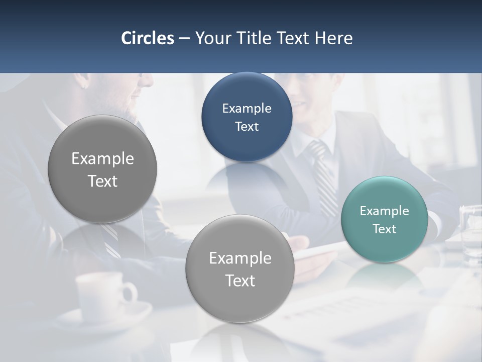 Two Men Sitting At A Table With A Tablet PowerPoint Template