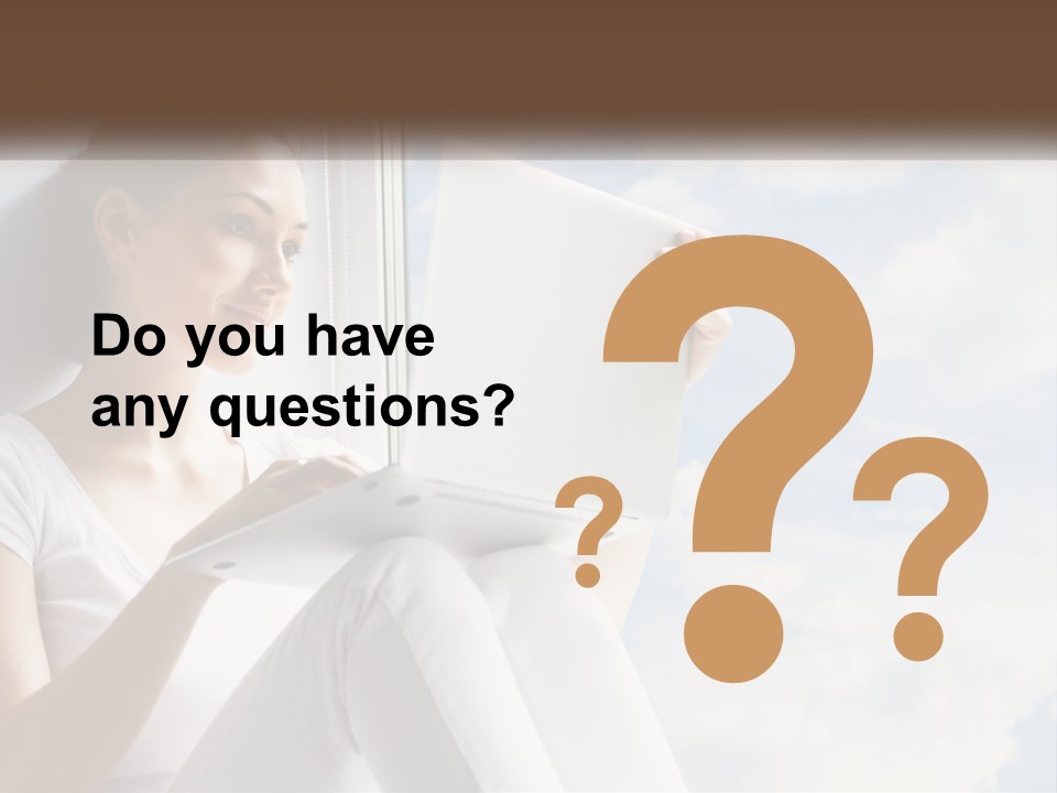 A Woman Sitting On A Window Sill Using A Laptop Computer PowerPoint Template