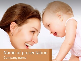 A Woman Holding A Baby Up To Her Face PowerPoint Template