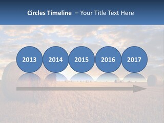 A Field With Hay Bales In The Foreground And A Sunset In The Background PowerPoint Template