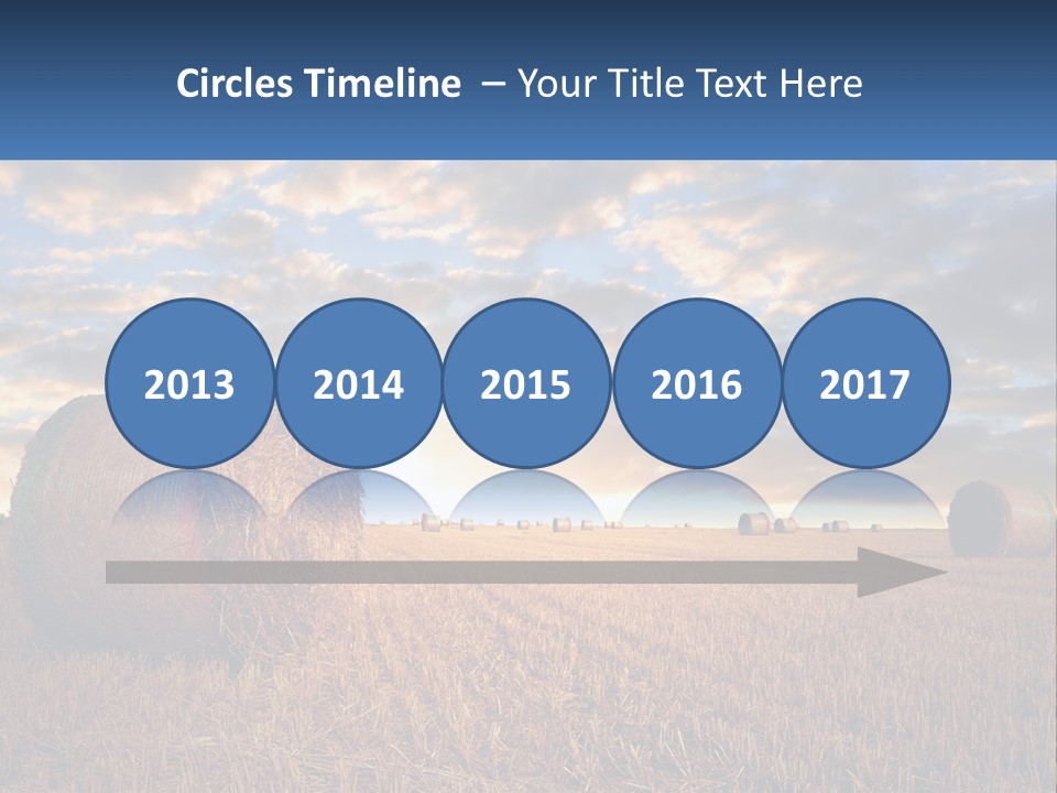 A Field With Hay Bales In The Foreground And A Sunset In The Background PowerPoint Template