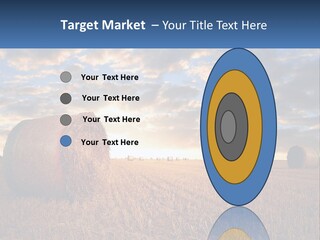 A Field With Hay Bales In The Foreground And A Sunset In The Background PowerPoint Template