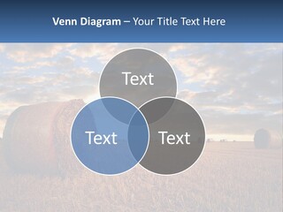 A Field With Hay Bales In The Foreground And A Sunset In The Background PowerPoint Template