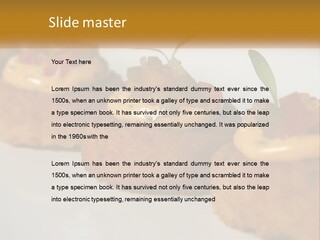 A White Plate Topped With Mini Cakes Covered In Toppings PowerPoint Template