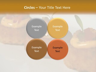 A White Plate Topped With Mini Cakes Covered In Toppings PowerPoint Template