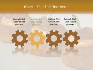 A White Plate Topped With Mini Cakes Covered In Toppings PowerPoint Template