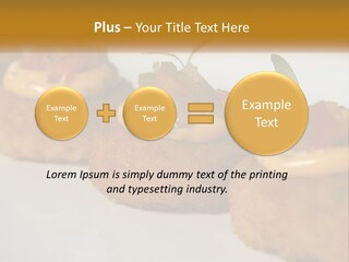 A White Plate Topped With Mini Cakes Covered In Toppings PowerPoint Template